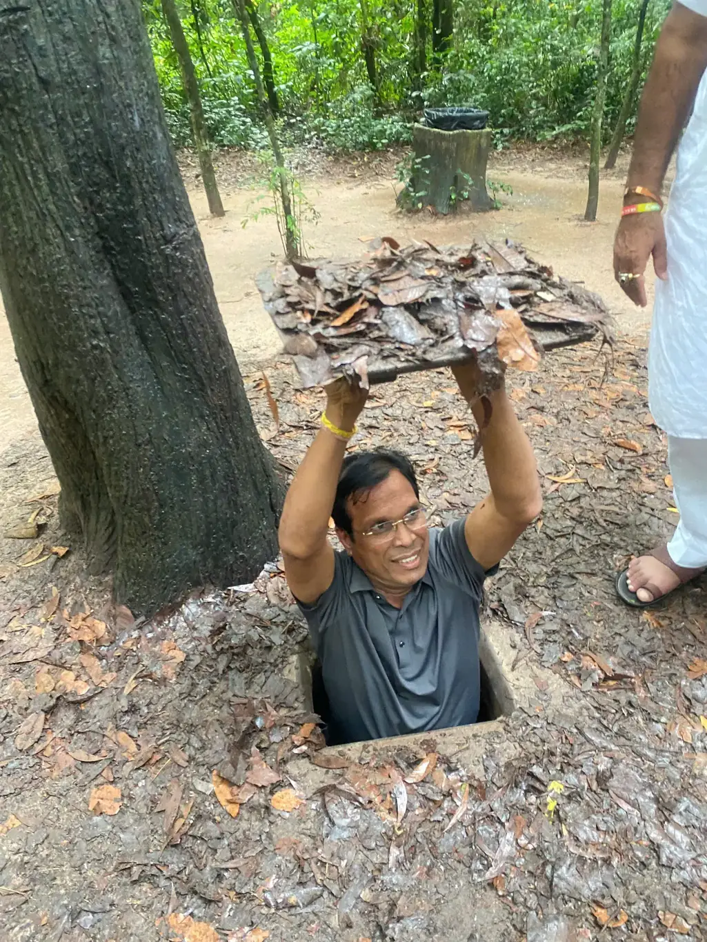 Entering the Cu Chi Tunnels with bookvietnamholiday.com