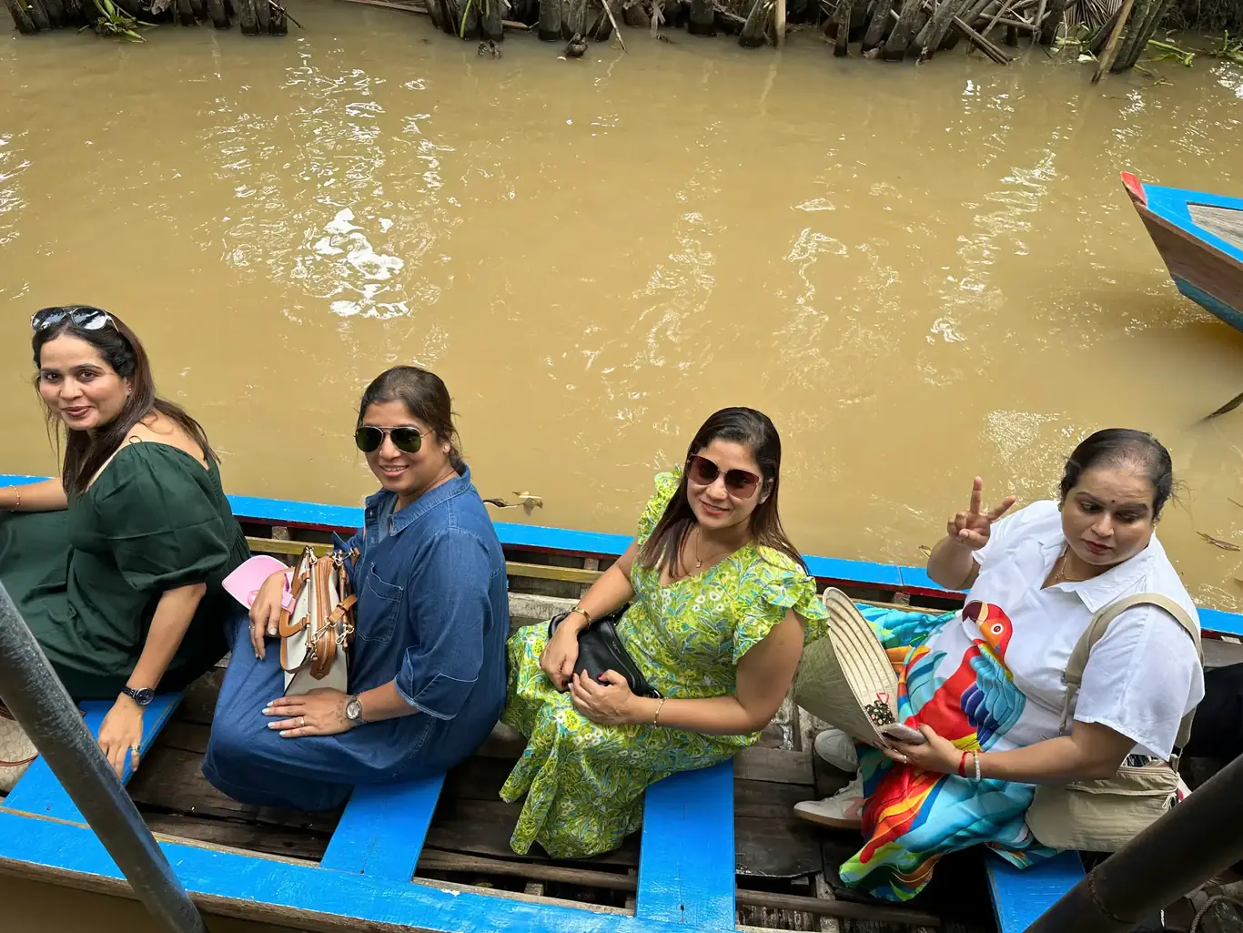 bookvietnamholiday.com guests on a Mekong Delta boat ride