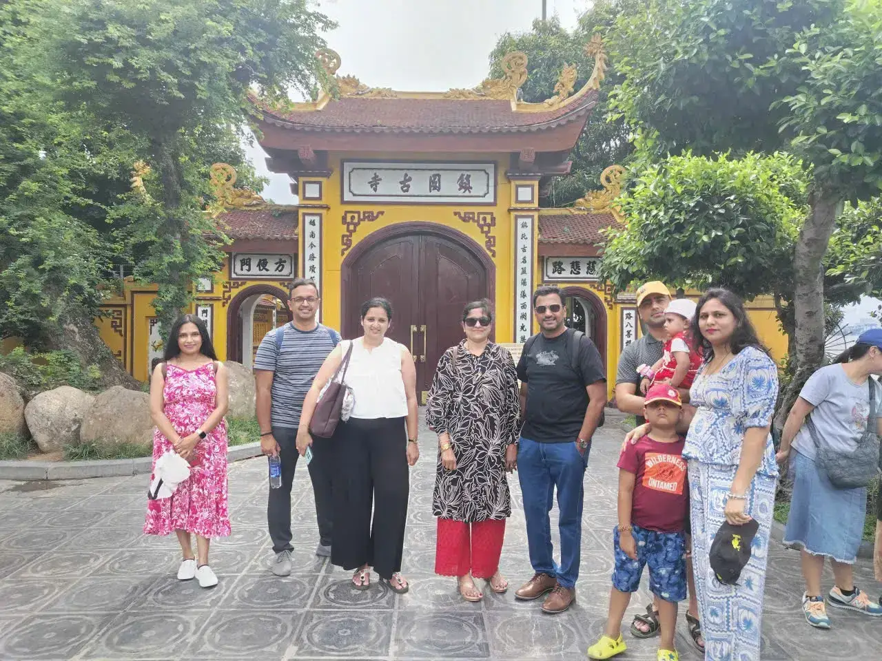 bookvietnamholiday.com clients at Trấn Quốc Pagoda gate, Hanoi