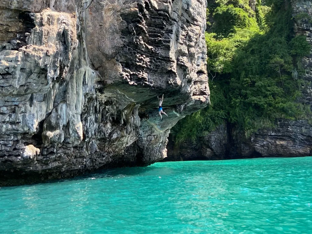 Rock climbing limestone karst Cat Ba Island Lan Ha Bay Vietnam