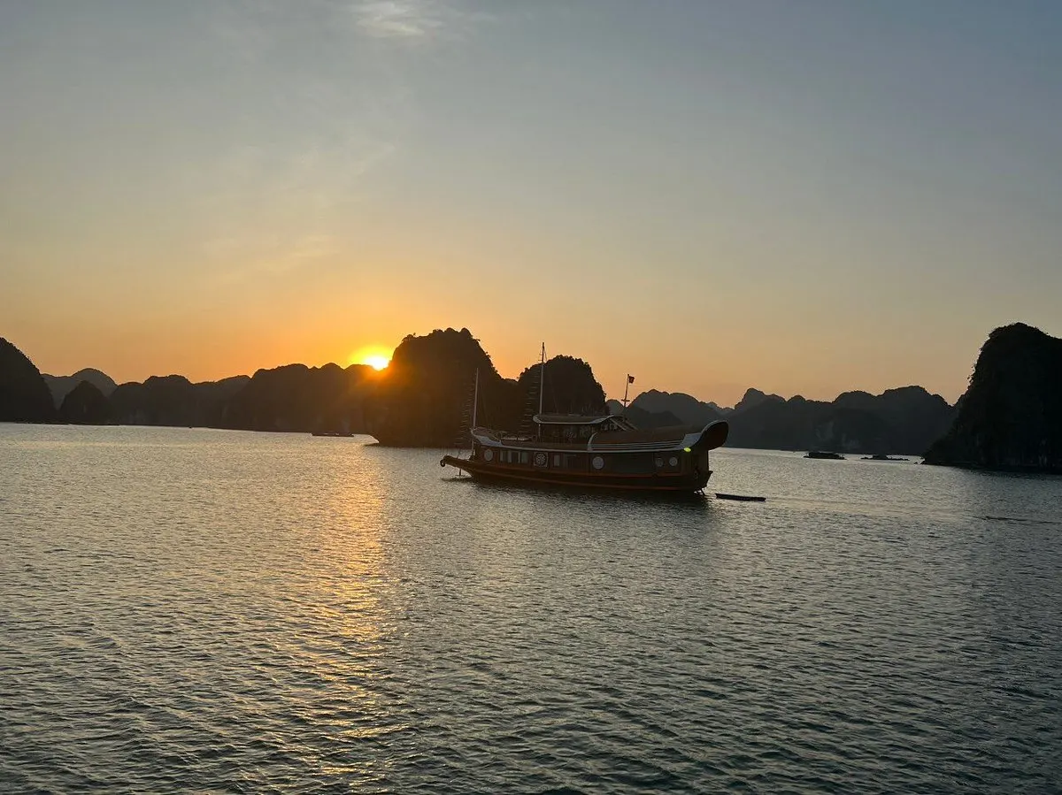 Sunset cruise Lan Ha Bay golden light karsts Cat Ba Vietnam