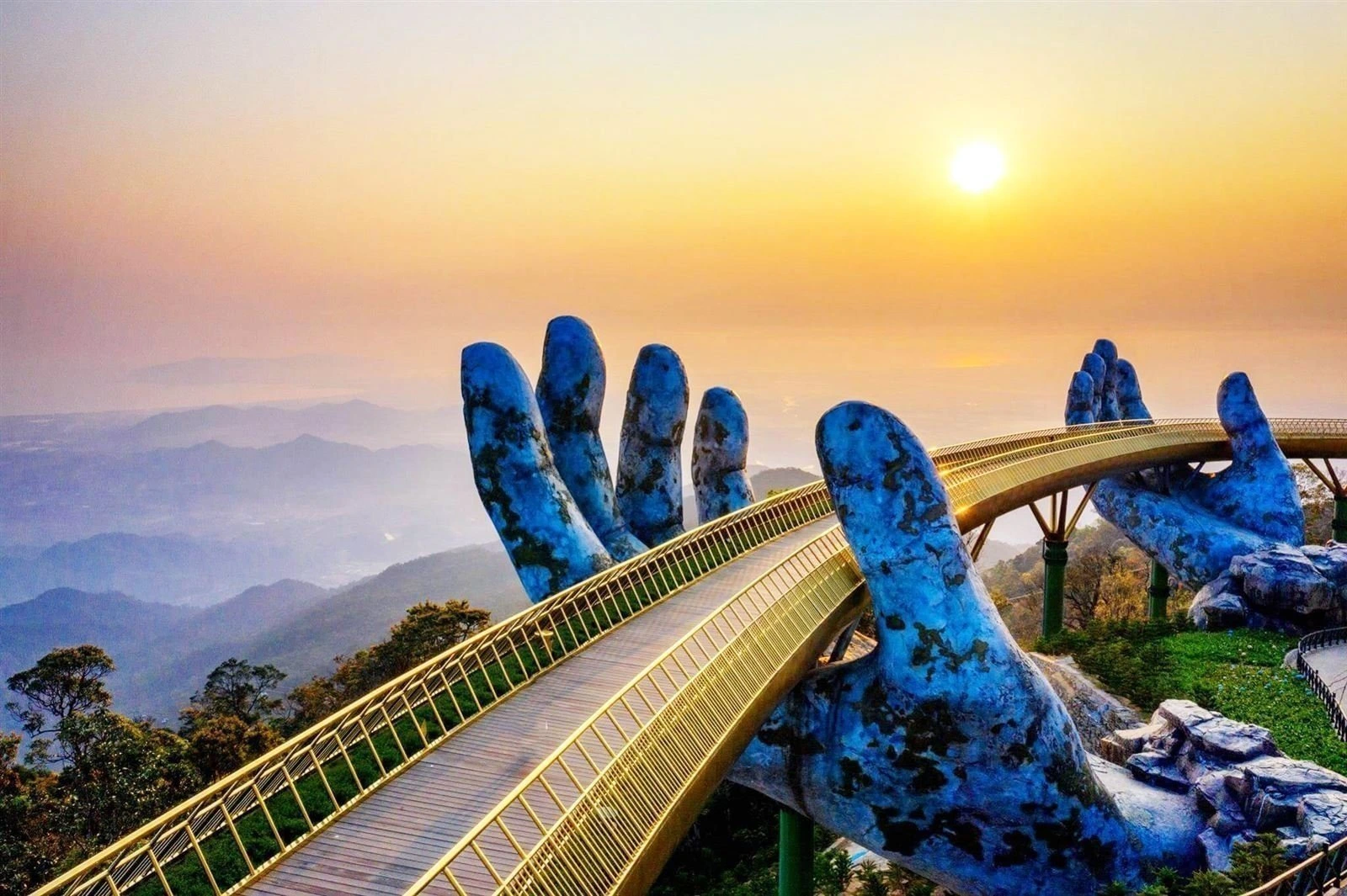 Golden Bridge held by giant stone hands at Ba Na Hills Da Nang