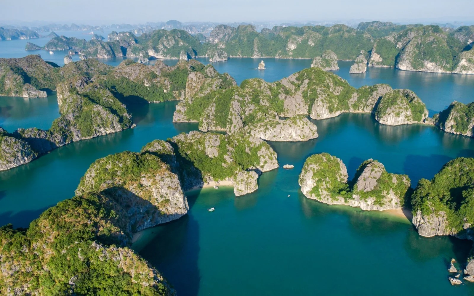 Secluded Lan Ha Bay with kayaks and limestone islands Vietnam