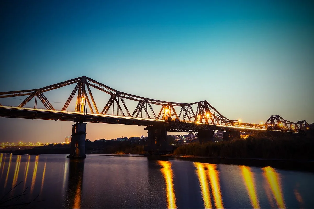 Long Bien Bridge Hanoi steel structure at sunrise