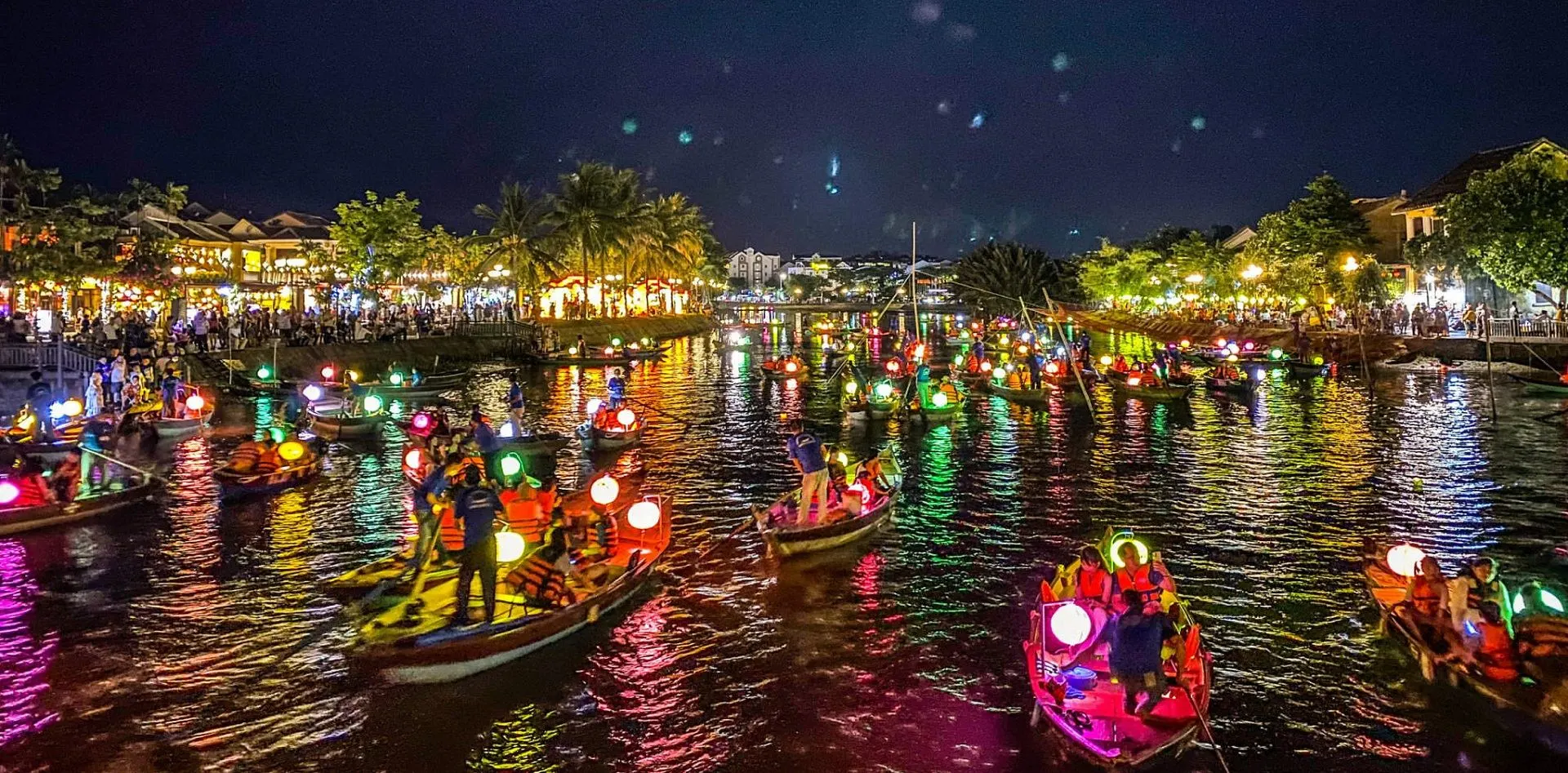 Sampan boat on Thu Bon River with paper lantern Hoi An at night