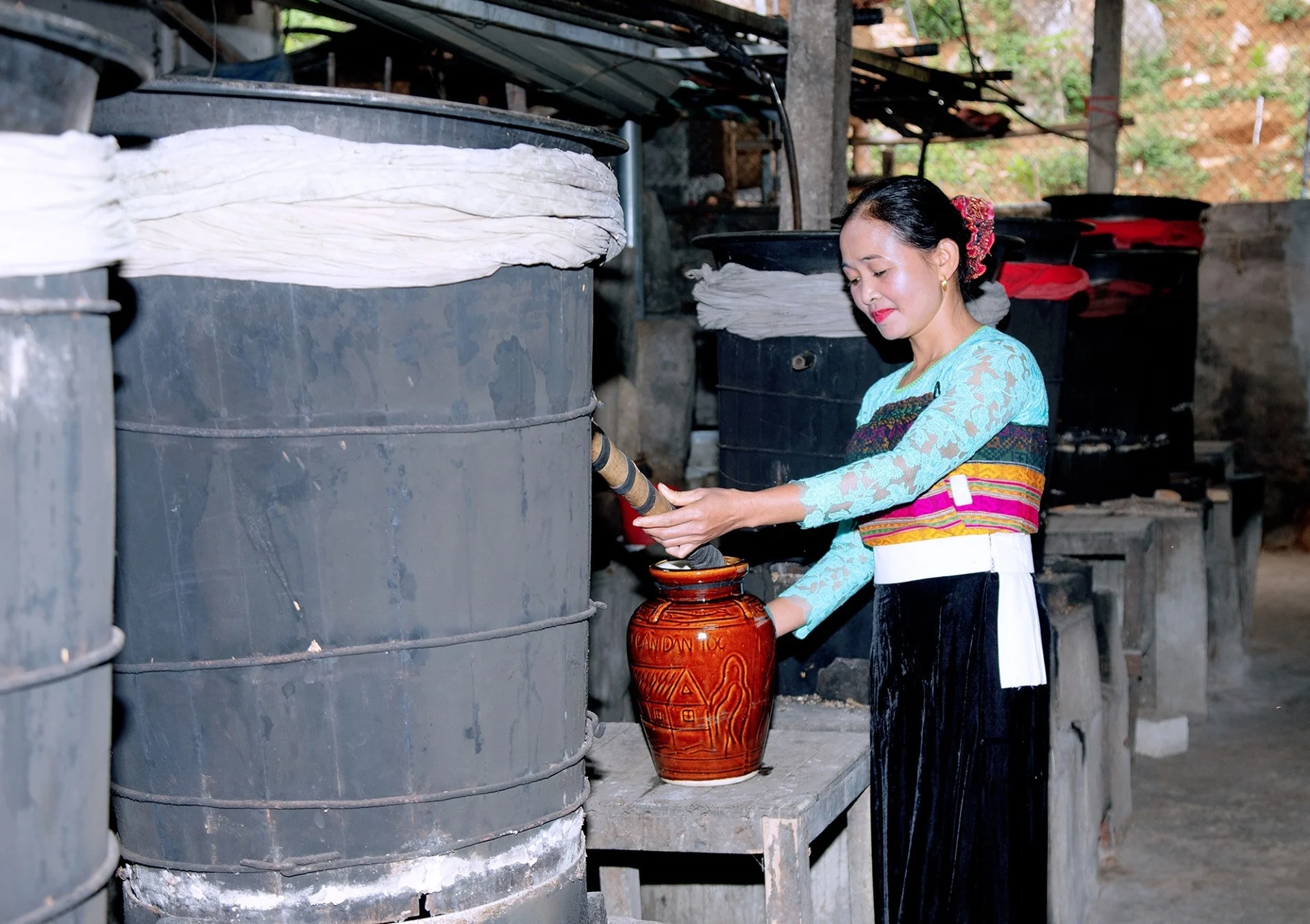 Thai traditional rice wine communal jar bamboo straws mai chau Vietnam