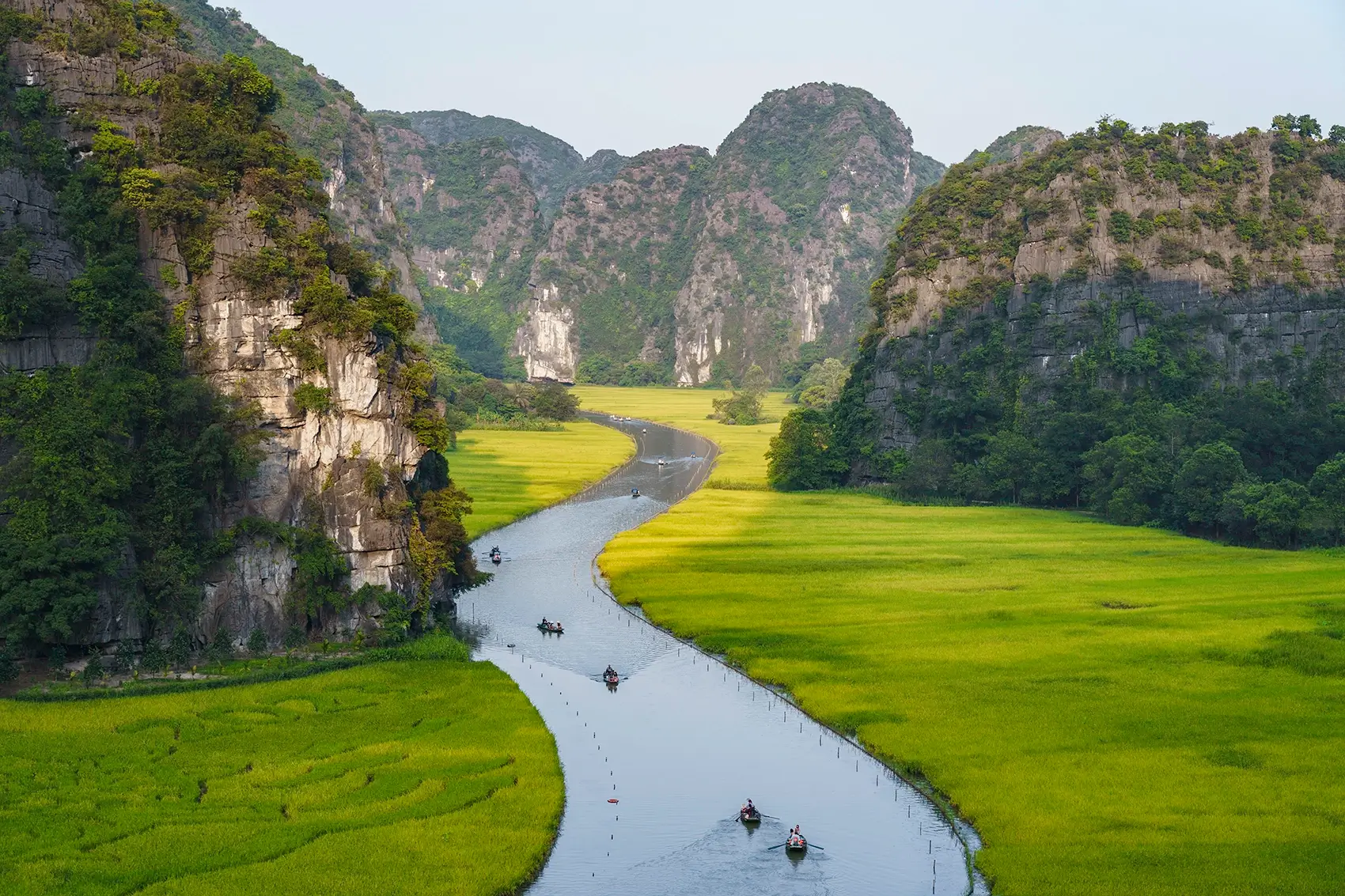 Tam Coc boat ride through rice paddies and limestone caves Vietnam