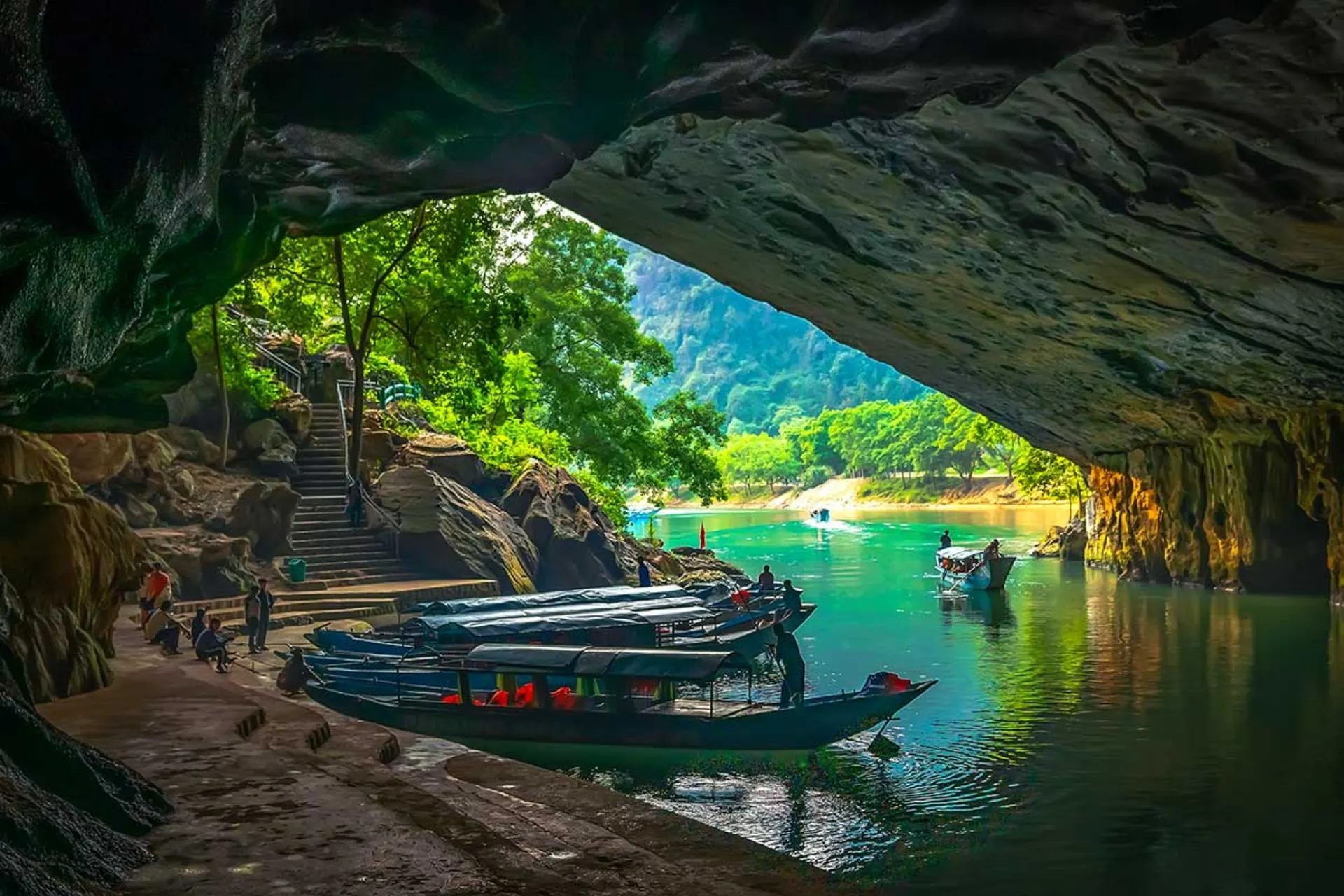Phong Nha Cave entrance motorised wooden boat underground river Vietnam