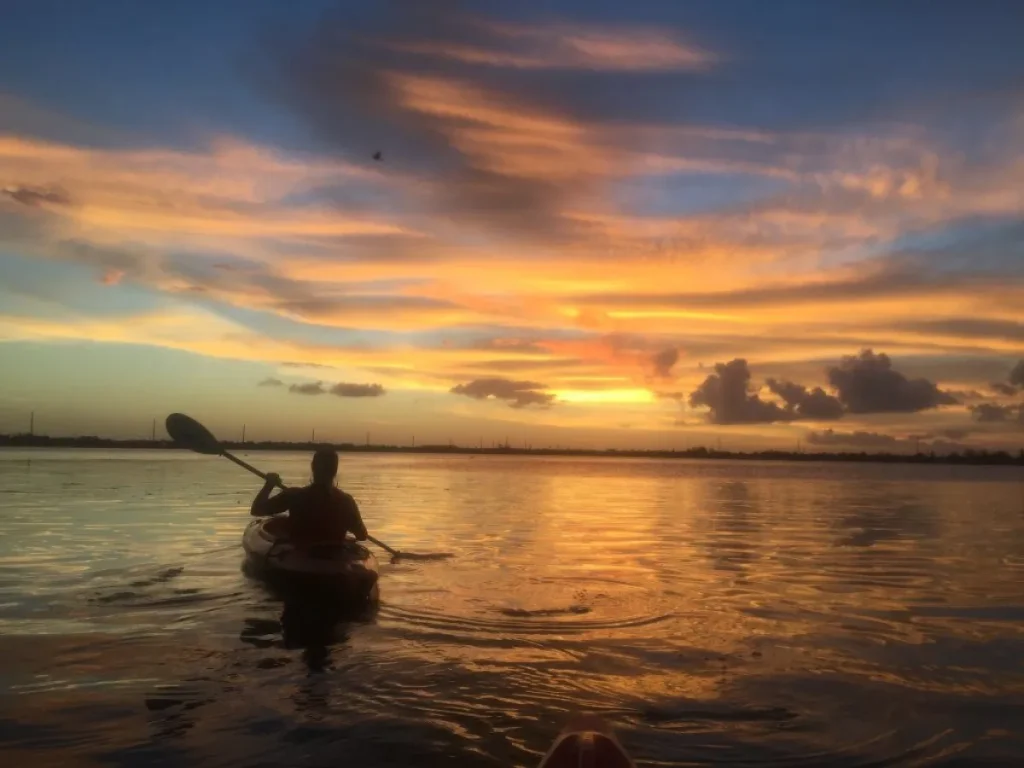 Son River kayaking sunset karst limestone peaks reflection Phong Nha Vietnam