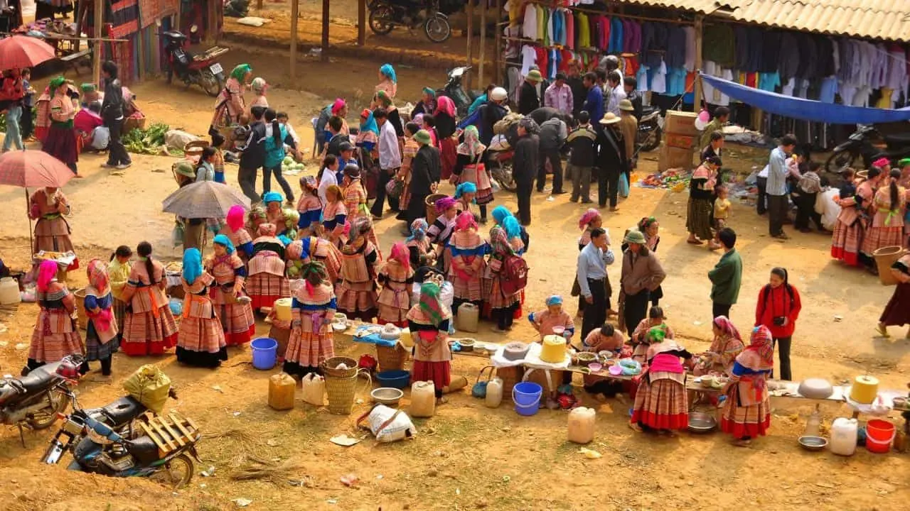Flower Hmong women in colourful traditional dress at Bac Ha Sunday Market Vietnam
