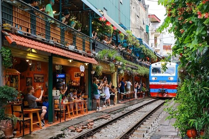 Hanoi Old Quarter street with lanterns and motorbikes